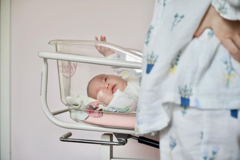 empty newborn bassinets in hospital maternity ward