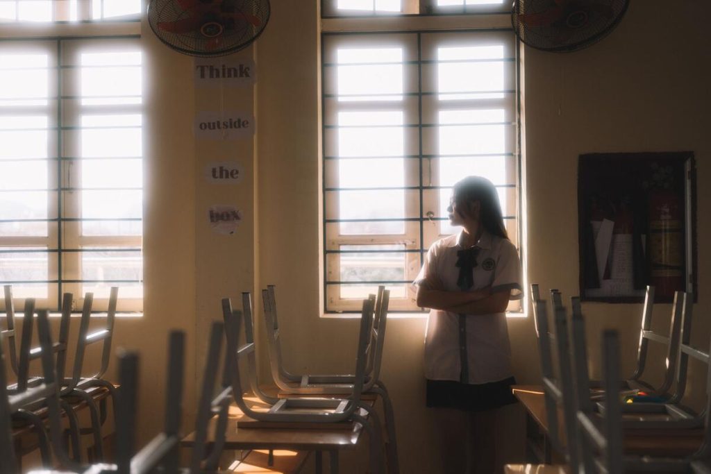 empty classroom with sunlight through window, no people