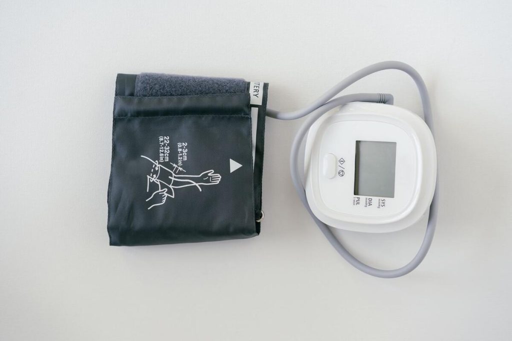 blood pressure and heart health monitoring equipment in clinic, no faces