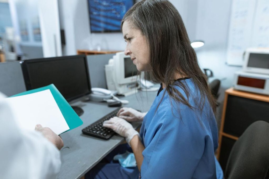 medical office reception desk with monitor and keyboard, no people