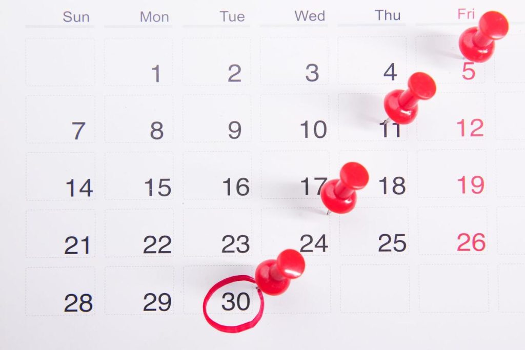calendar with doctor appointment reminder note, close up