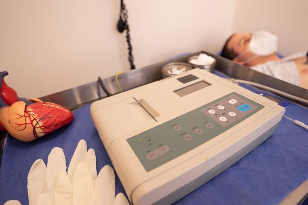 close-up of a cardiac catheterization procedure room with medical monitors, no people visible