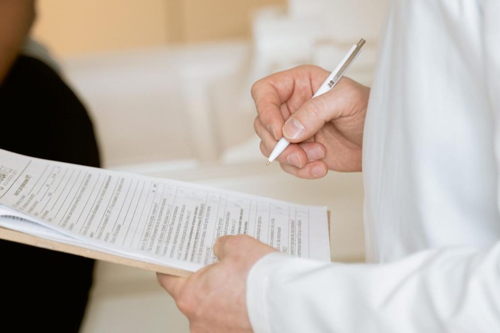 doctor reviewing kidney function lab results on a tablet, close-up, no faces