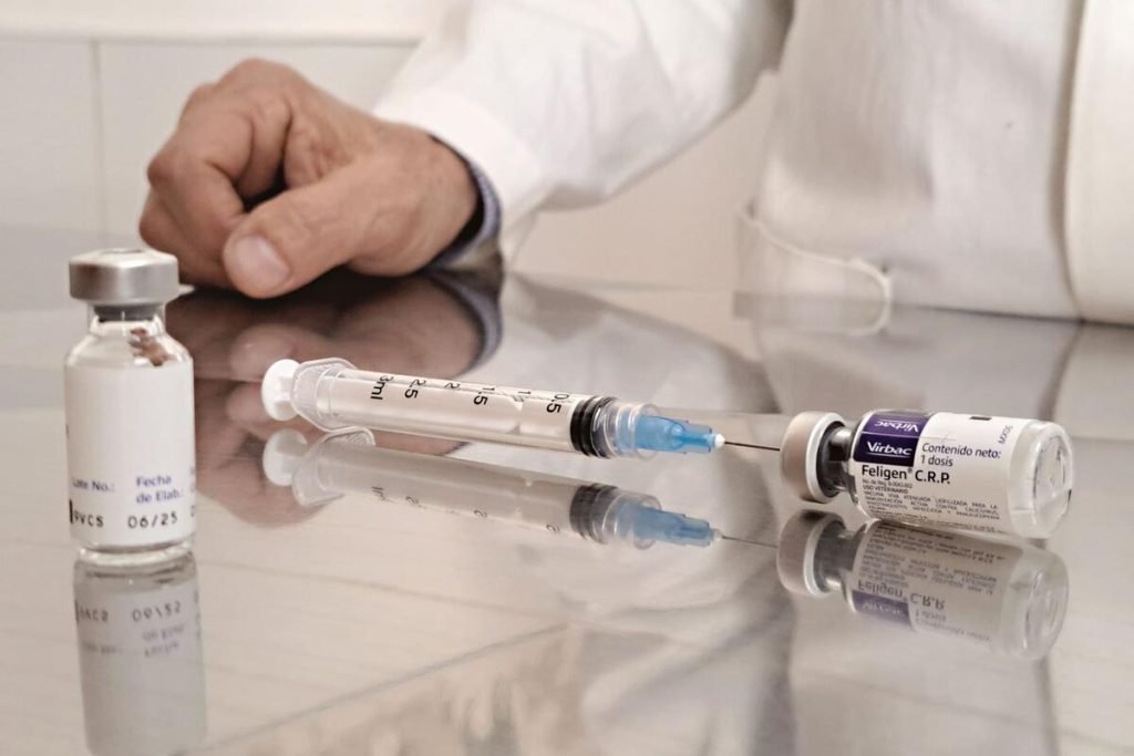 close-up of eye drops or injection vial in clinical setting, no visible faces