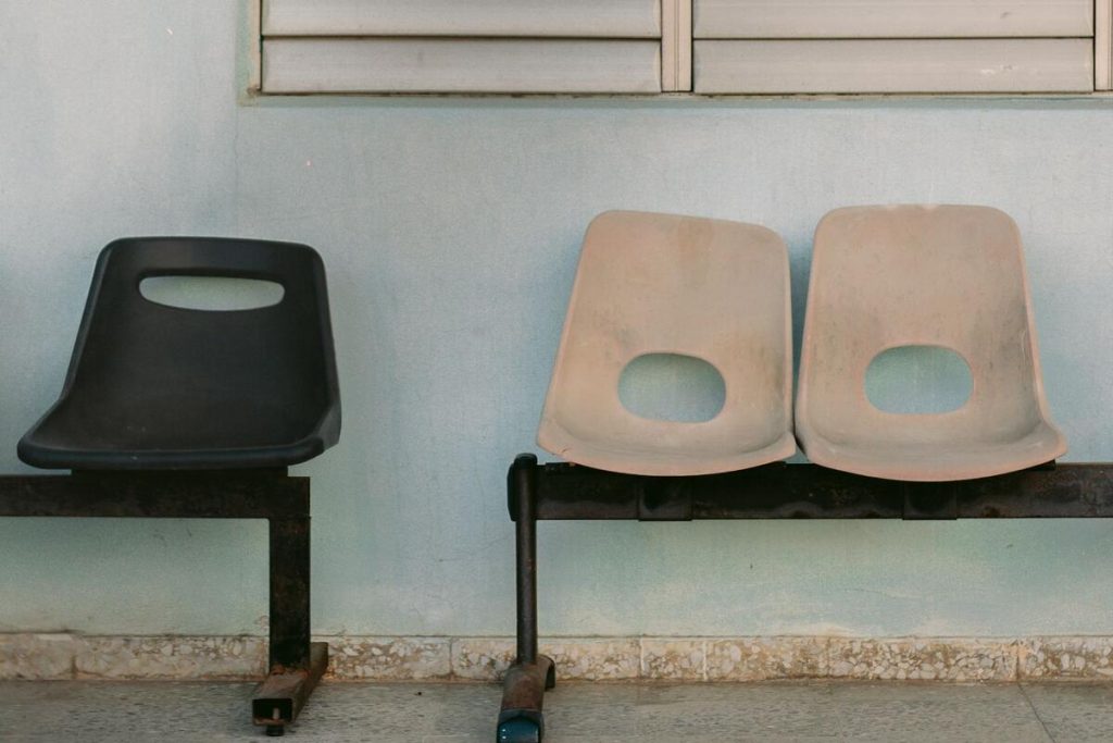 empty waiting room chairs in a rural family medicine clinic, warm daylight, no people