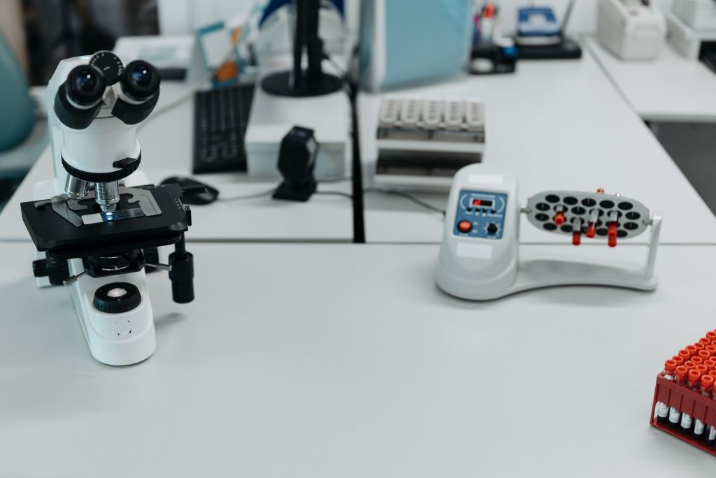 medical laboratory with microscope and cancer research equipment, no people