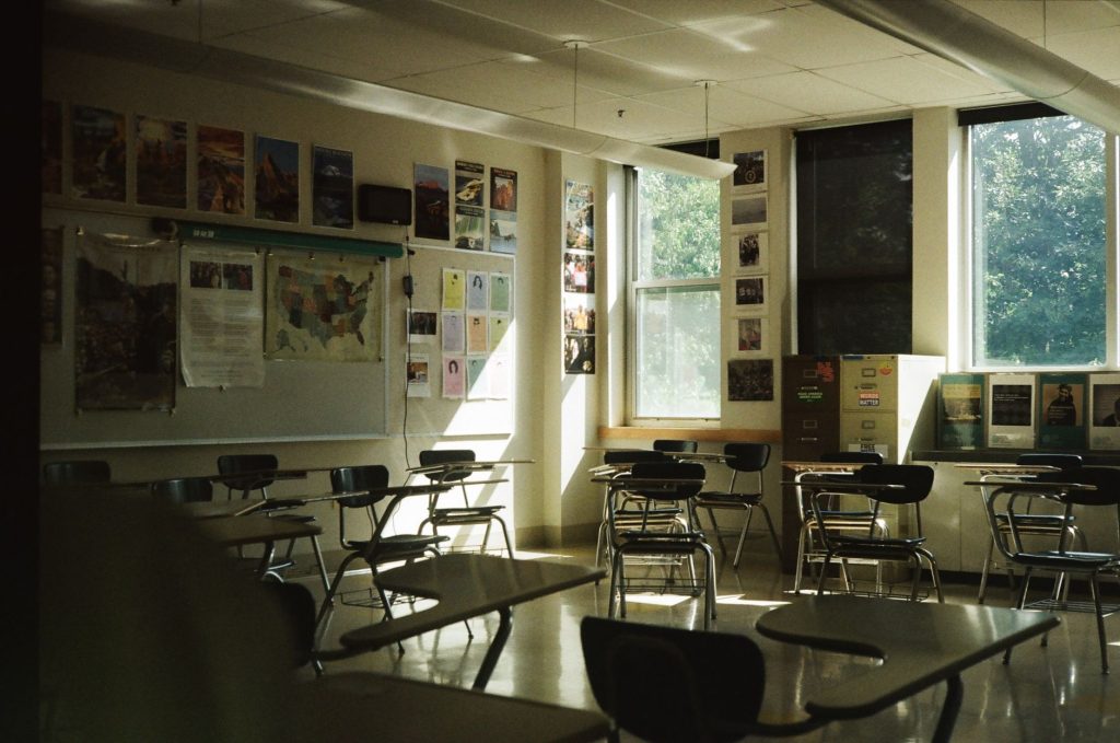 adult education classroom with empty chairs and a whiteboard, daytime, no people