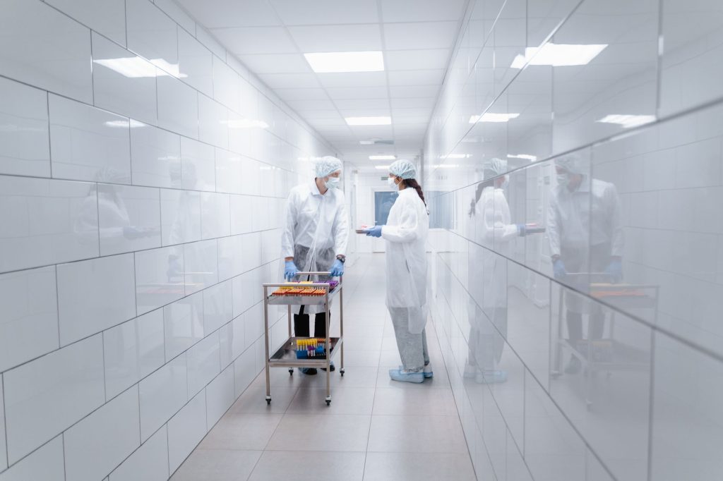 Croatian hospital corridor with medical staff walking, no faces visible